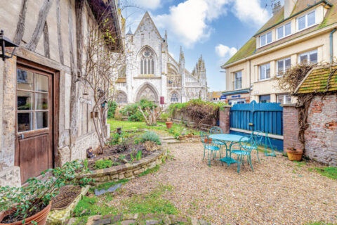 1 rue Tatin, Louviers, Normandy view of the garden and Collégiale Notre Dame de Louviers