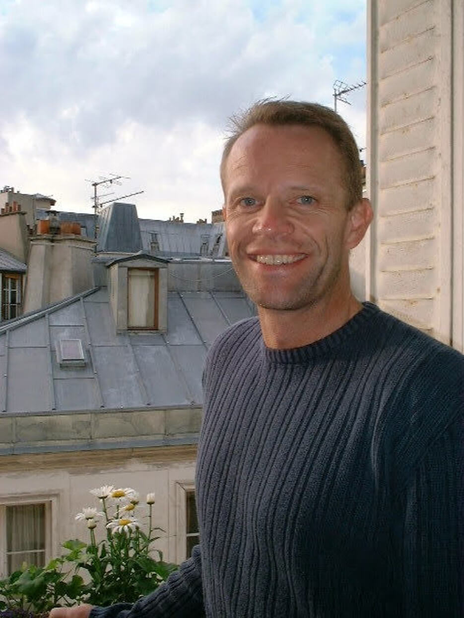 Schuyler Hoffman in the window of his apartment in Paris while he worked with Adrian Leeds