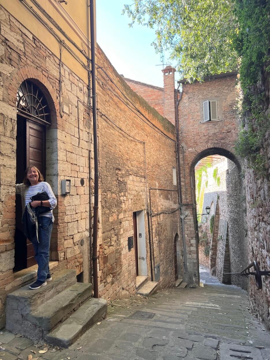 Adrian's cousin, Leslie, at her door in Perugia