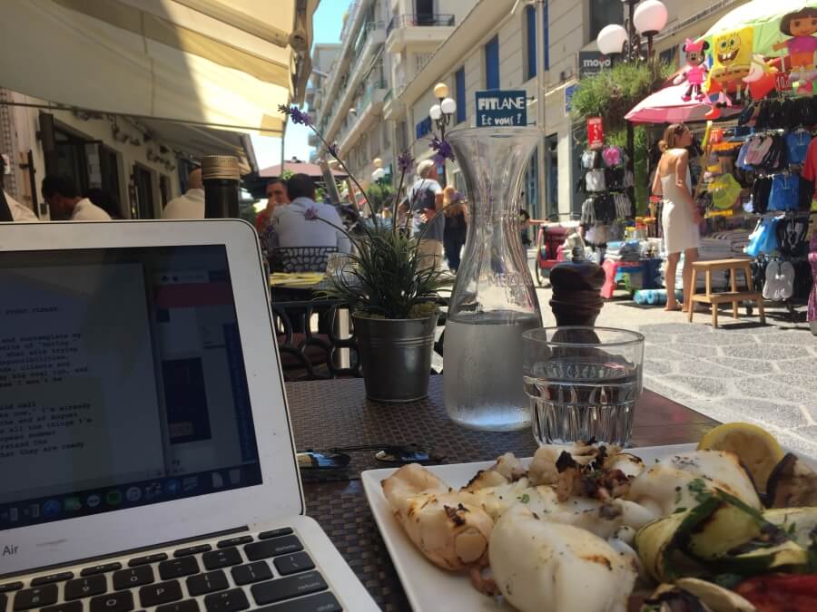 A laptop on the table at a cafe, demonstrating remote working