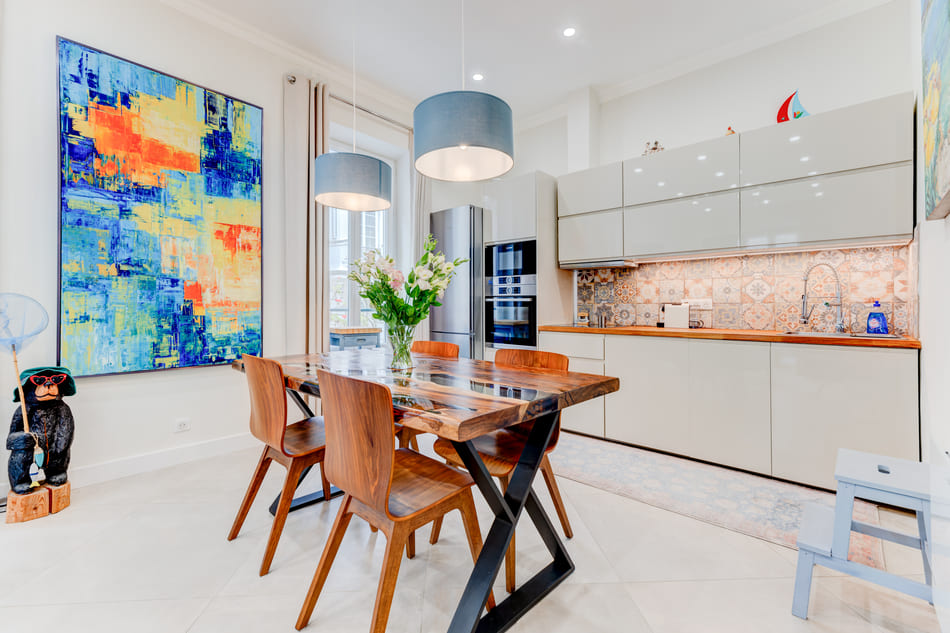 Large kitchen with ample dining space and bright windows 10 Rue Chauvain Nice