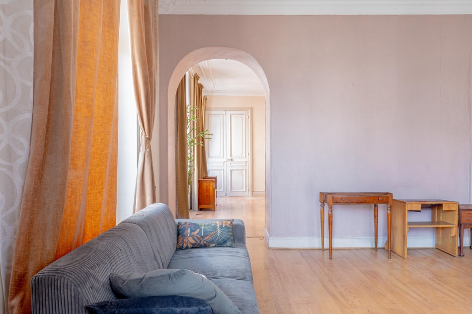 Large living with french doors and archway to dining 11-rue-bailly