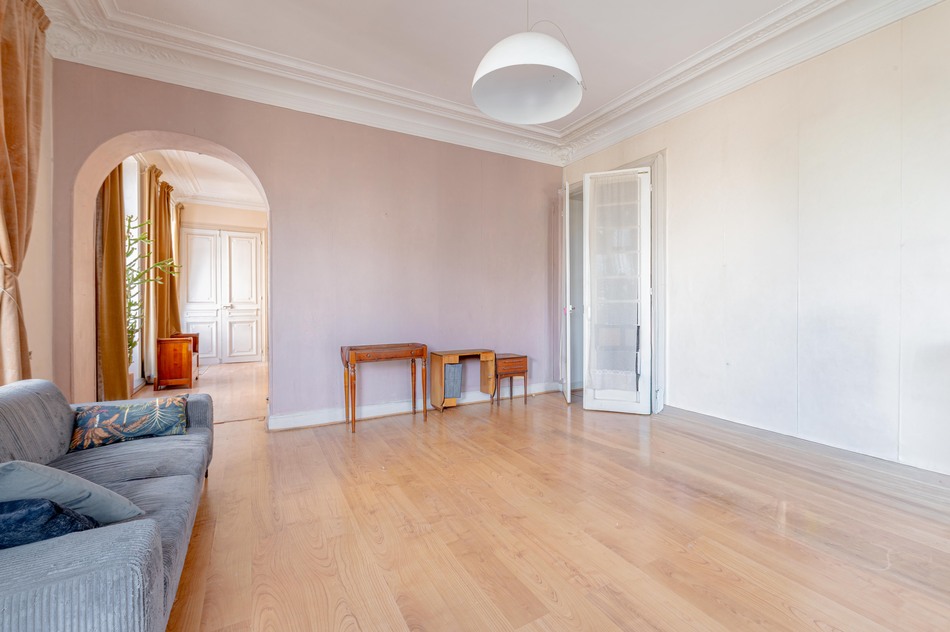 Large living with french doors and archway to dining 11-rue-bailly