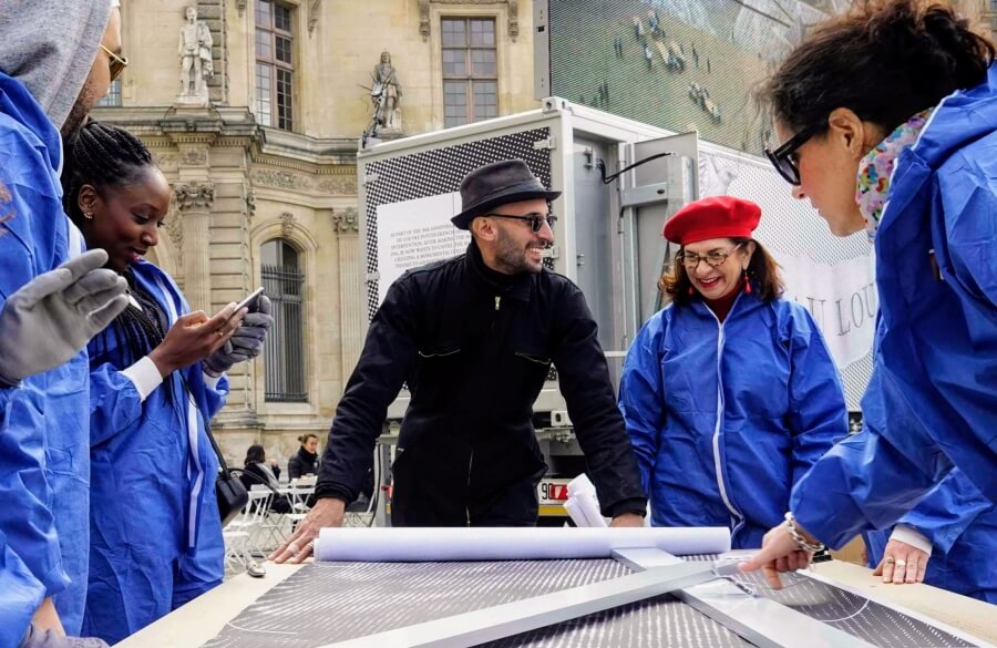 Adrian Leeds with artist JR at the Louvre in Paris, France