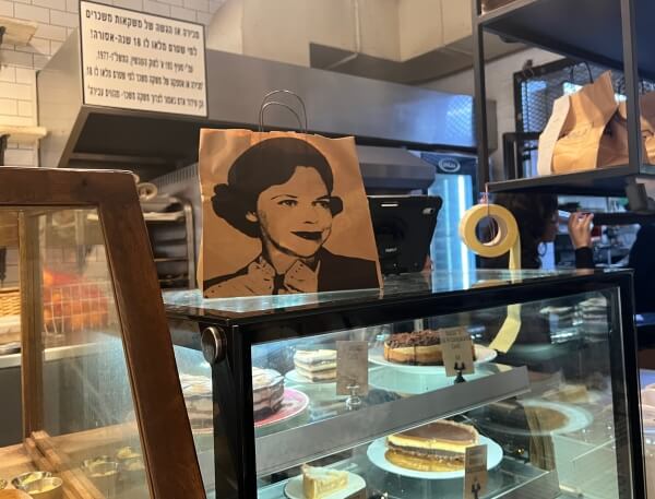 Takeout bag with image of Kathy's mother as a young woman, at NOLA