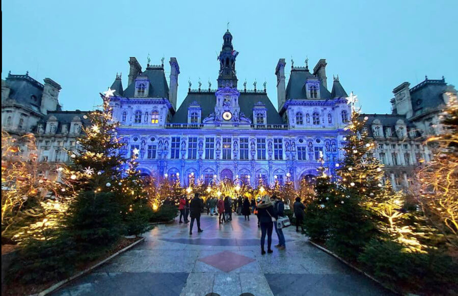 he Hotel Deville square lit up in Paris, France