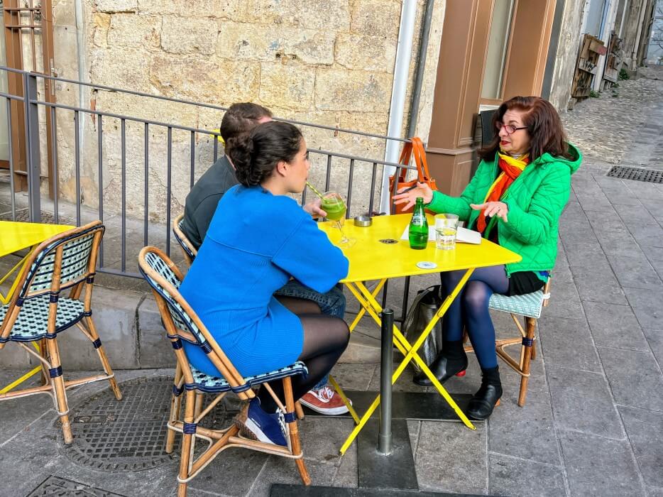 Adrian Leeds meets with House Hunters International contributors at a cafe in Montpellier, France