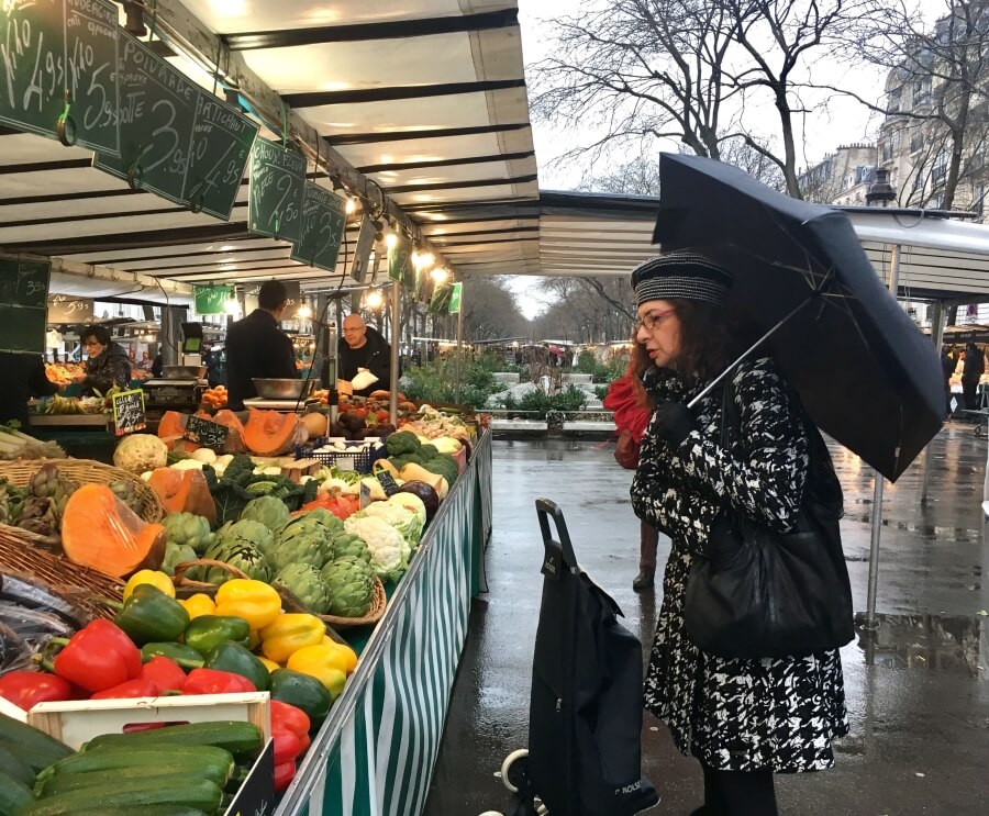 Adrian Leeds shopping at a local market in Paris
