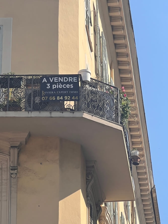 A Vendre, for sale sign on an apartment building in France