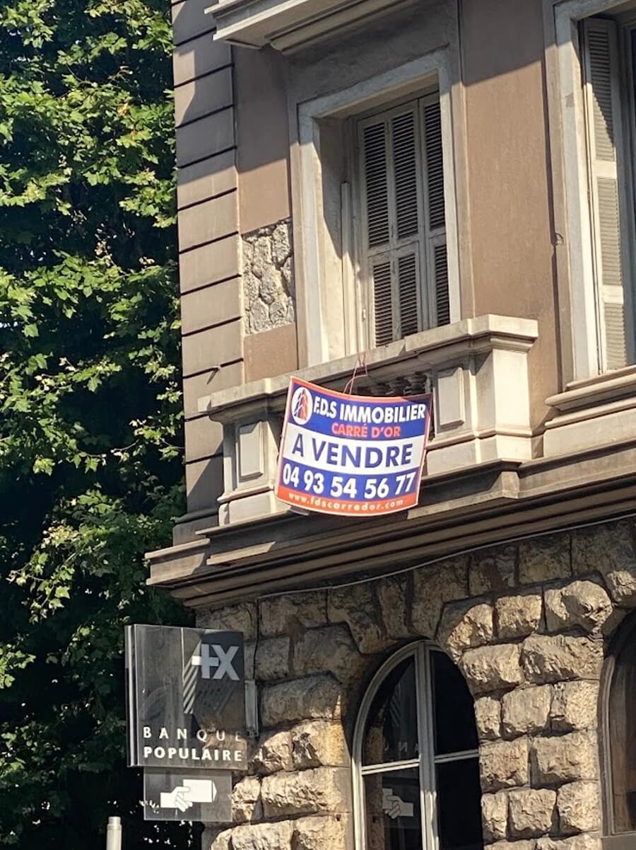 A Vendre, for sale sign on an apartment building in France