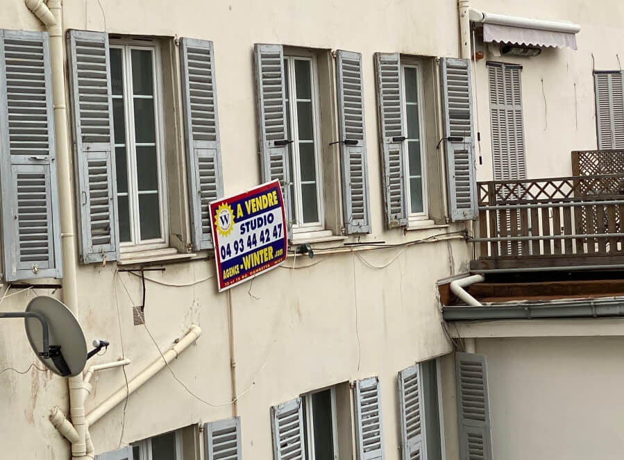 A Vendre, for sale sign on an apartment building in France