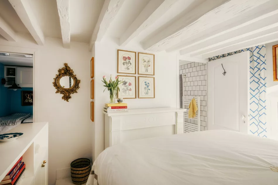 Main bedroom with storage and window overlooking courtyard Converted Carriage, 25 Rue Saint-Dominique Paris