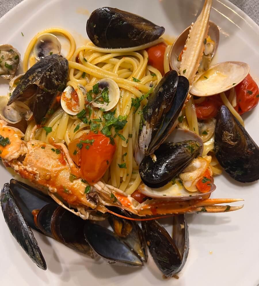 A bowl of Linguine alla scoglio at Osteria da Carmela in Naples, Italy