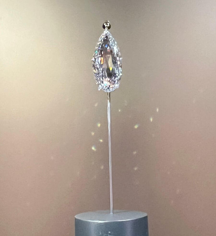 The 90 carat diamond for the Al Thani collection oh exhibit at Promotional poster for the Joyaux Dynastique exhibit at The Hôtel de la Marine in Paris, France