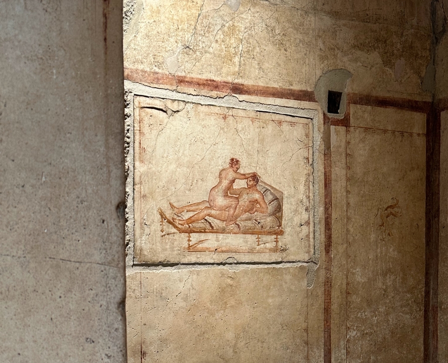 An erotic fresco in the Villa Vettii in Pompeii