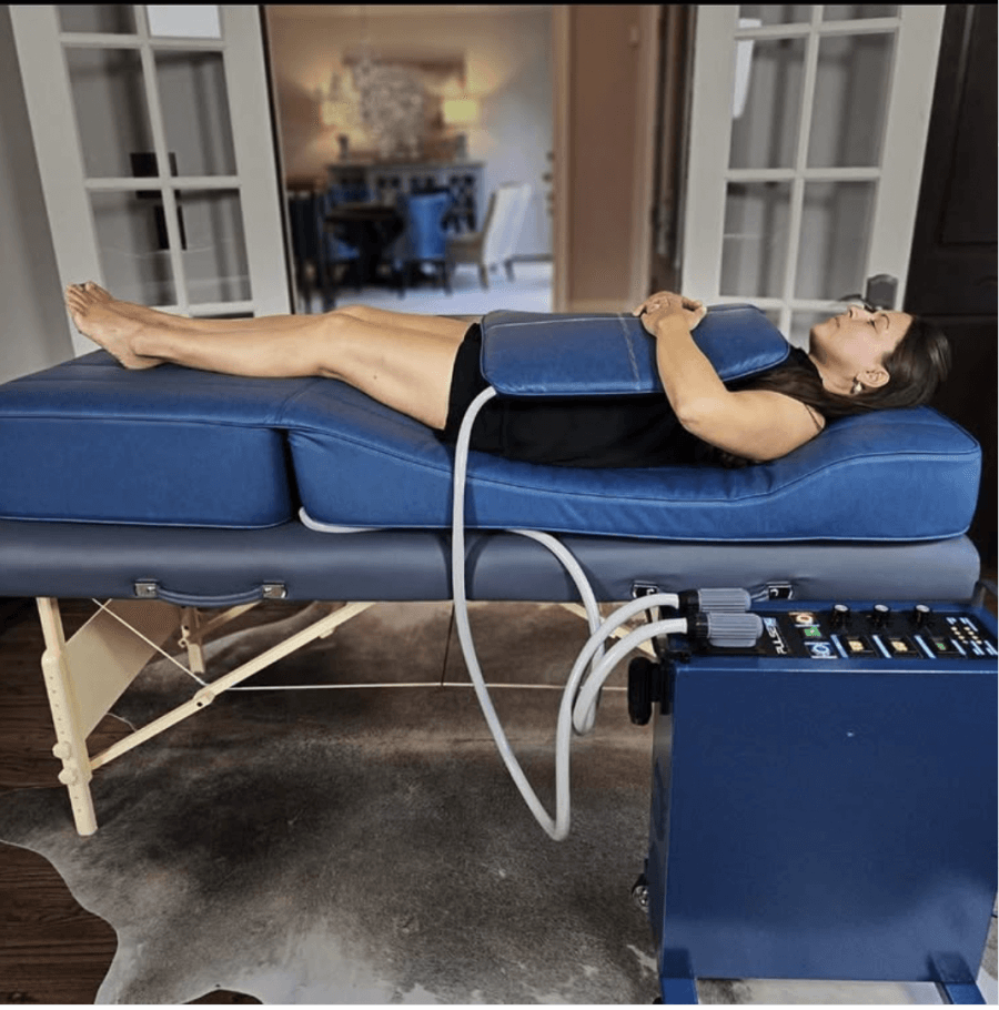 A woman lying on a PEMF mat