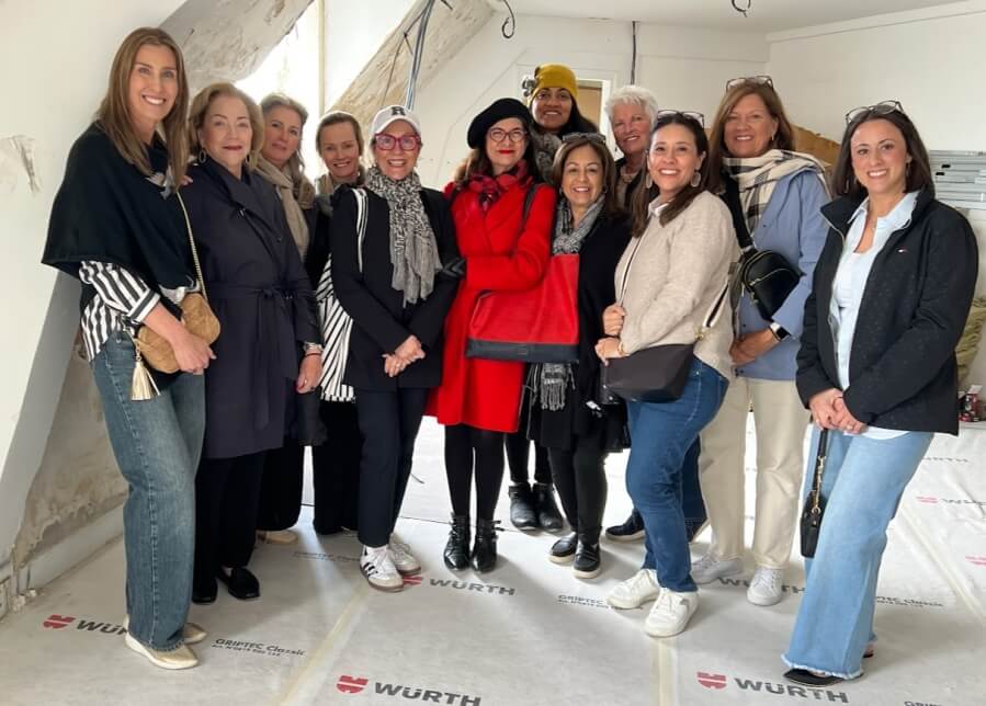Adrian Leeds, Jane Byrd, and group of real estate professionals visit Adrian Leeds' daughter's apartment in Paris