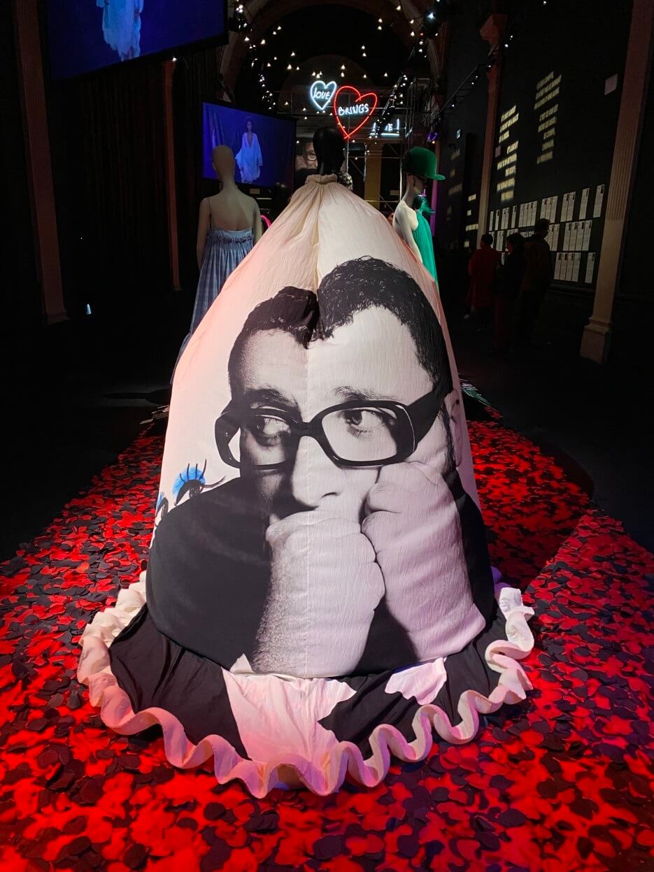 Alber Albaz's face superimpose on a designer gown on exhibit at the Galliera in Paris
