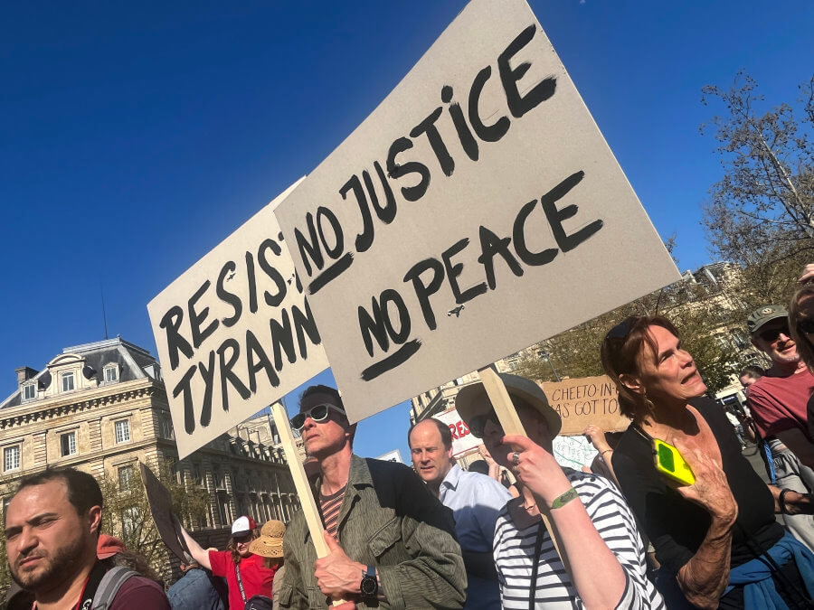 A handmade posters at the Hands Off protest in Paris, France, photo by Lisa Anselmo