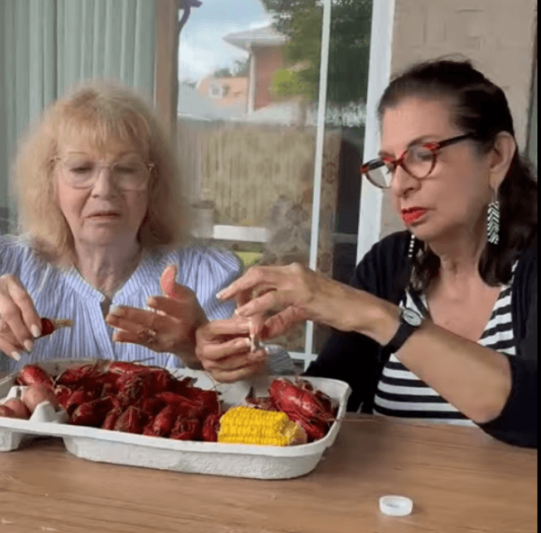 Diana, Adrian's sister, and Adrian Leeds eating Louisiana crawfish