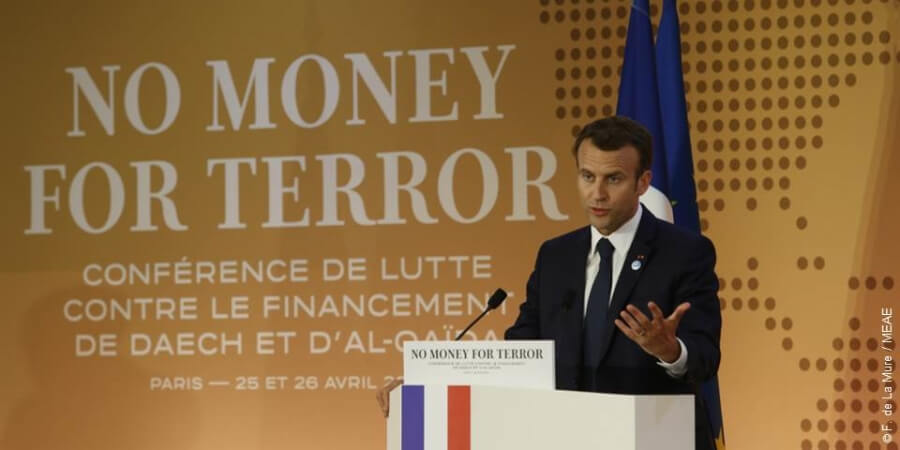 Screenshot of French President Macron speaking at a conference on terrorism in France