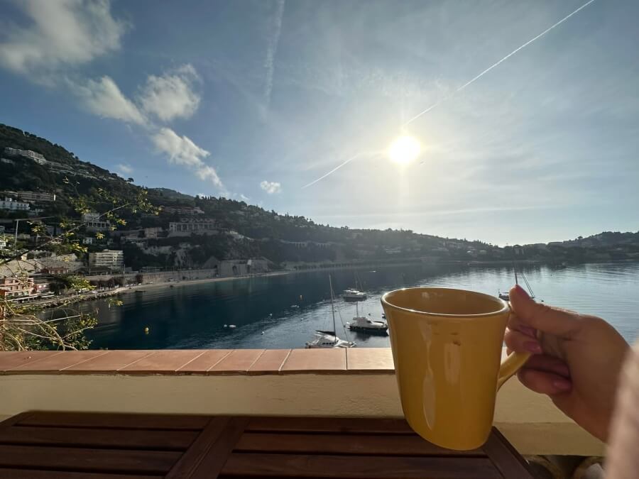 Enjoying a cup of coffee on the terrace of La Belle Terrasse fractional property in Villefranche-sur-Mer, France