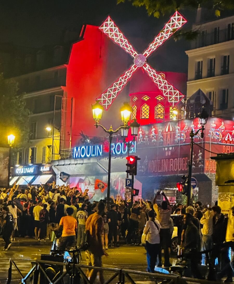 The crowd celebrating the PSG championship wine at Place Pigalle in Paris, France