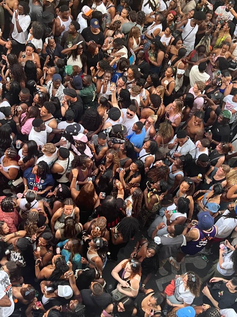 The Fête de la Musique crowd packed around the entrance to Adrian Leeds' apartment building in Nice, France