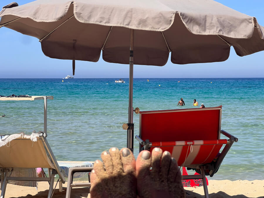 Toes in the sun on the beach in Nice, France