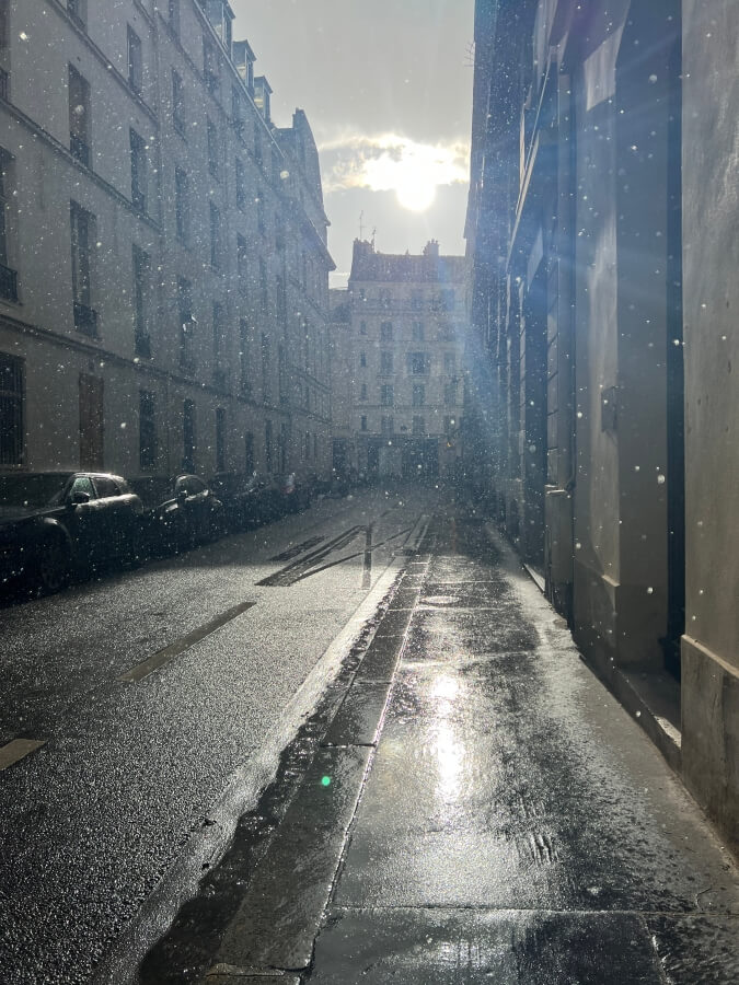 Raining in sunshine in Paris, France