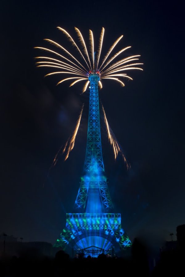 The Eiffel Tower in Paris lit in blue for Bastille Day