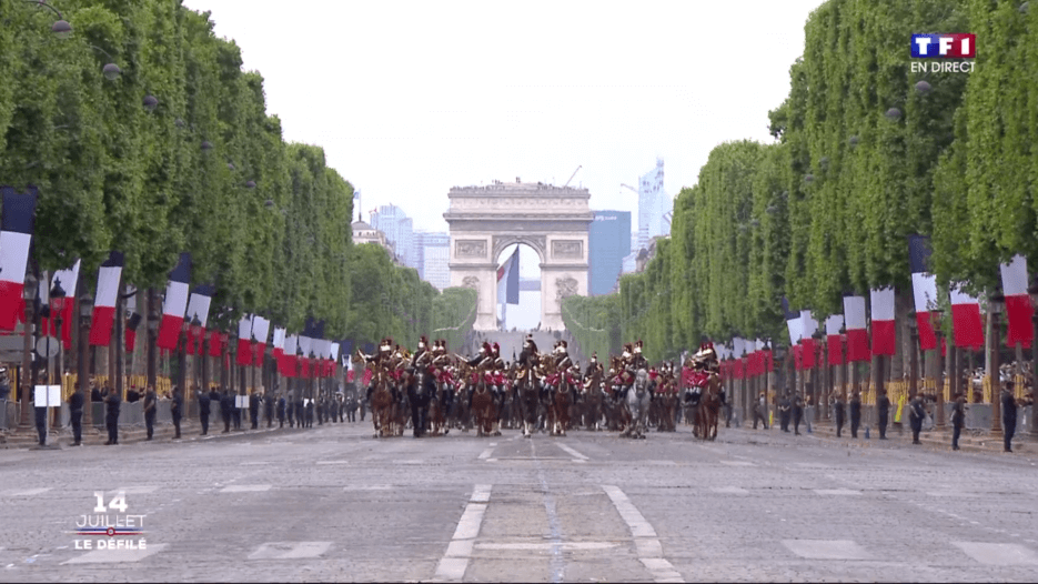 The military parade down the Champs-Elysees at the Arc de Triumph