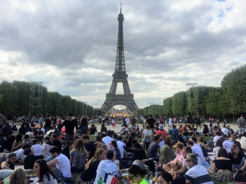 The crowd picnicing on the Champ de Mars in Paris, France