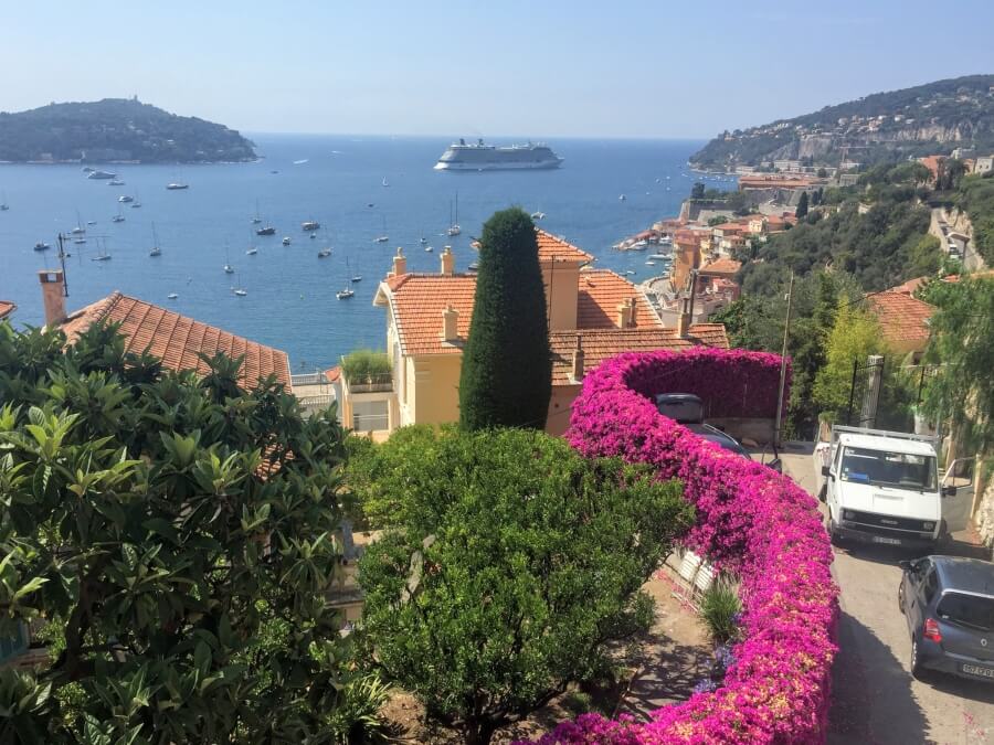 A winding road on the French Riviera with a view of the sea