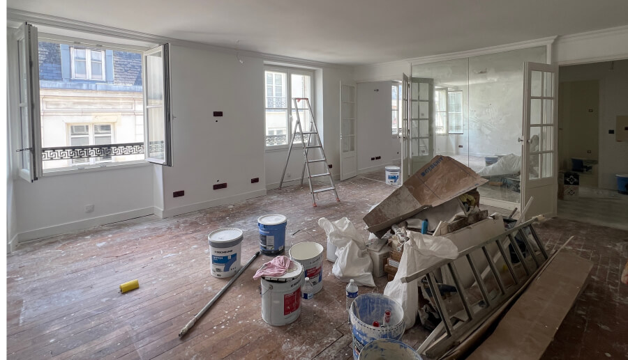 The living room under renovation in Adrian Leeds' apartment in Paris