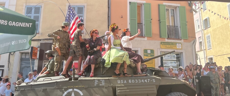 The 81st anniversary parade with people in period costume on a tank