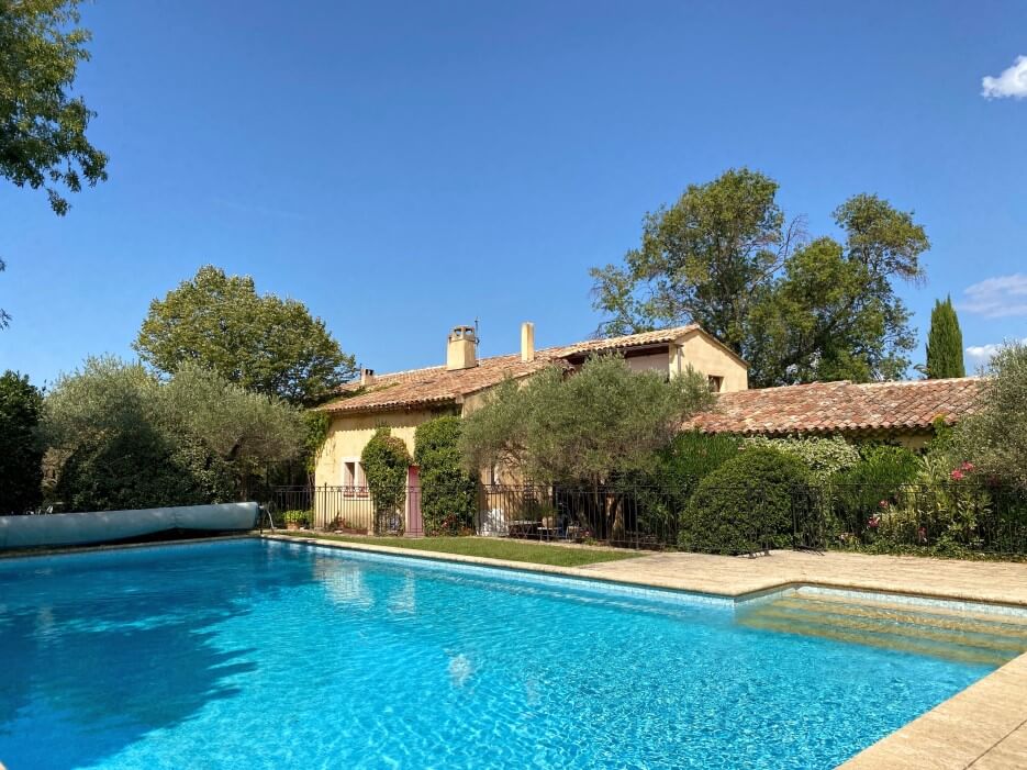 View of the pool and house at Les Olivettes in Lourmarin France