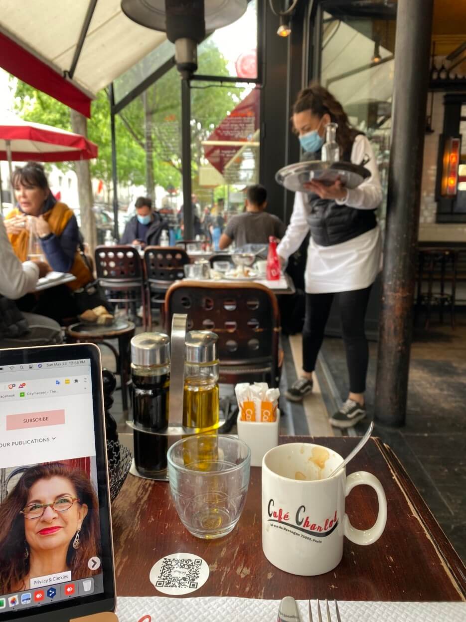 Adrian Leeds at work in her favorite spot at Café Charlot in Paris