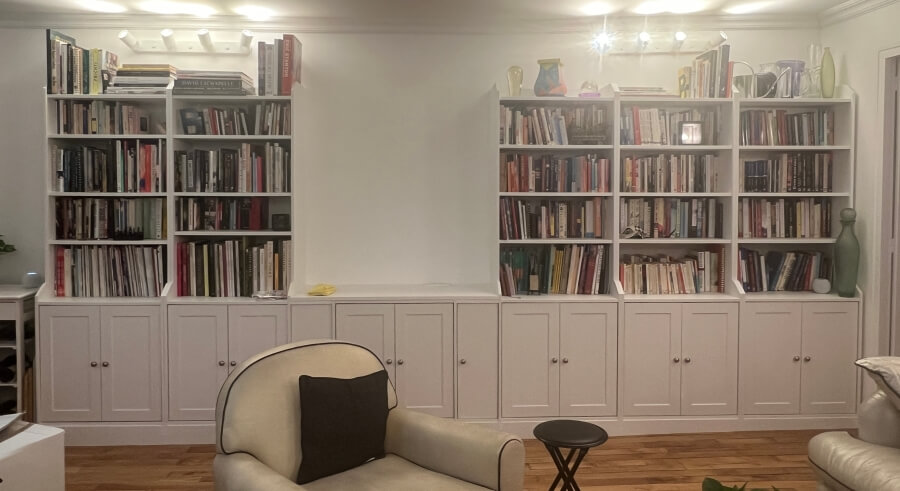 The built-in bookshelves in Adrian Leeds' Paris apartment, filled with books