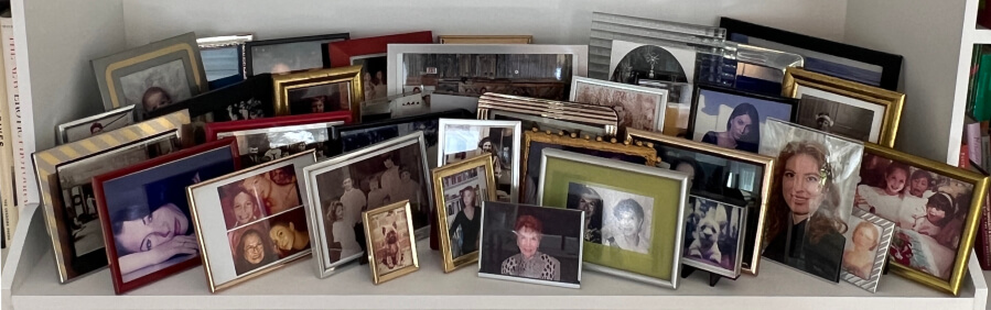 Adrian Leeds' collection of family photos displayed on her new bookshelves