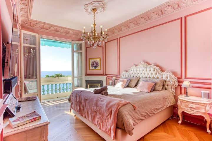 Master bedroom with view of the sea in Nice, France at Spacious Belle Époque