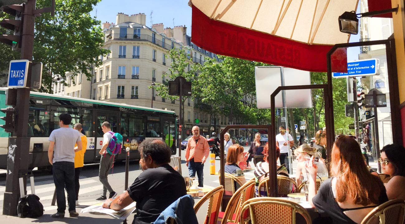 People enjoying a sunny day outside at a Paris cafe Copyright Lisa Anselmo