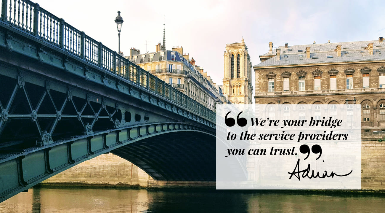 Bridge over the Seine river with a quote from Adrian