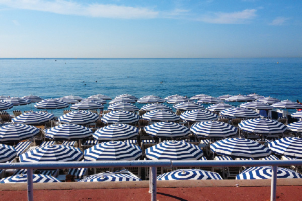 Blue umbrellas overlooking the blue sea in Nice