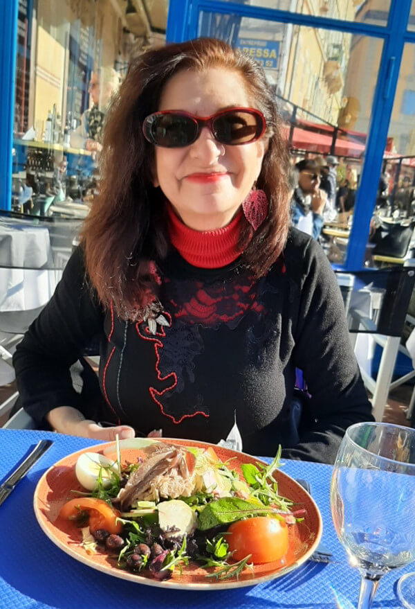 Adrian Leeds dining on a Salade Niçoise at Le Safari