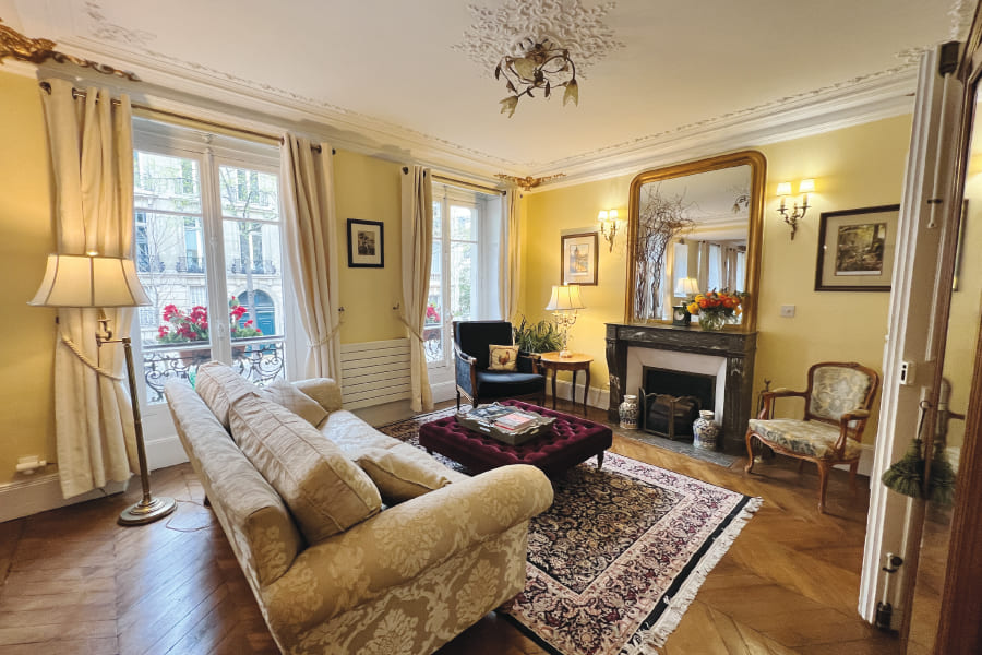 Chez La Tour's bright large beautiful living area with fireplace and large windows