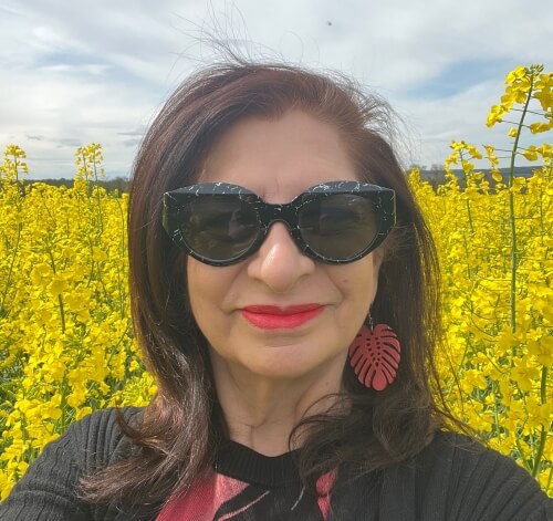Adrian Leeds in a field of yellow colza in eastern France