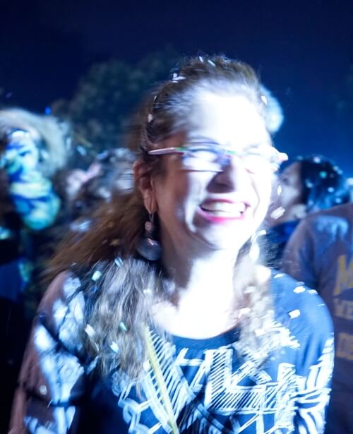 Adrian Leeds covered in descending confetti