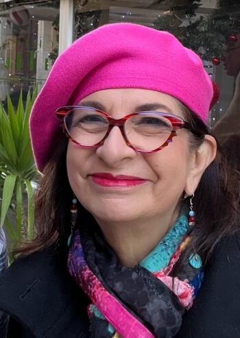 Adrian Leeds wearing a signature beret