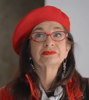 Adrian Leeds in her signatur red scarf and red beret